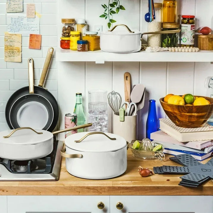 Wholesale Price with free shipping across the USA for Beautiful 12pc Ceramic Non-Stick Cookware Set with Strainer Lids, White Icing by Drew Barrymore - Manji Distributors